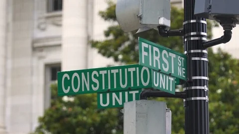 CONSTITUTION AT FIRST ST STREET SIGN - WASHINGTON DC Stock Footage