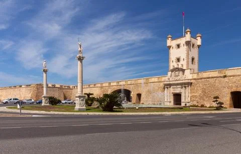 Constitution Square and the main gate in the city wall of Cadiz. Stock Photos