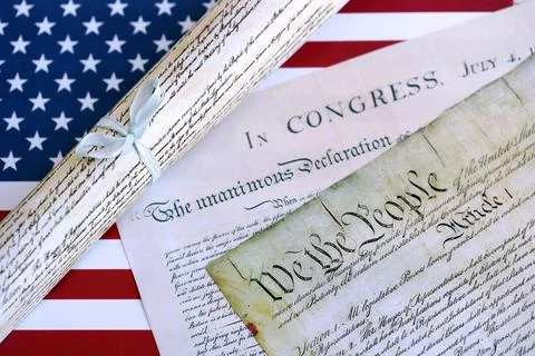 Constitution of the USA with US flag. Aged historical documents Stock Photos