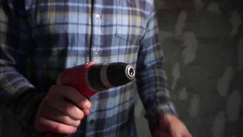 Constroction worker collects impact driver Stock Footage 69806394