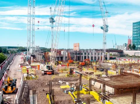 Constructiion building site with diggers and cranes Stock Photos
