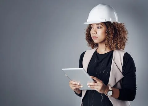 Constructing cities in her mind. a well-dressed civil engineer using her tablet Stock Photos