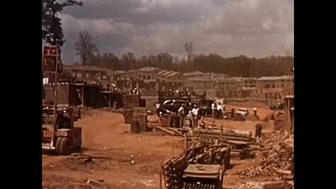 Constructing new homes, building ships, a steel mill, a tire factory, a Vídeos de archivo 95598881