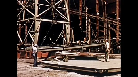 Constructing new homes, building ships, a steel mill, a tire factory, a 動画素材 95598893