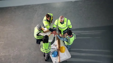 Construction, above and people with hand stack for planning, teamwork or support Stock Footage 341661389