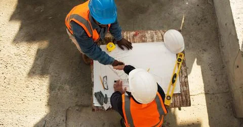 Construction, above or people with handshake for blueprint agreement, civil Stock Photos