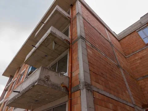 Construction activity in building under development in a city Stock Photos