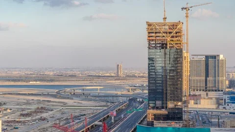 Construction activity in Dubai downtown with cranes and workers timelapse, UAE. Stock Footage 110787596