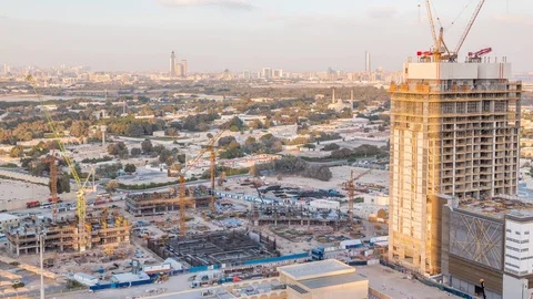Construction activity in Dubai downtown with cranes and workers timelapse, UAE. Stock Footage 110790588