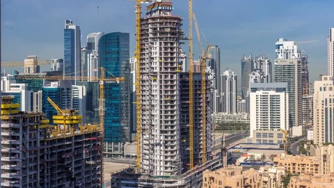 Construction activity in Dubai downtown with cranes and workers timelapse, UAE. Stock Footage 110951049