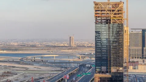 Construction activity in Dubai downtown with cranes and workers timelapse, UAE. Stock Footage 120390928