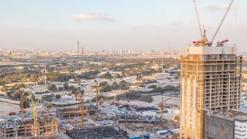 Construction activity in Dubai downtown with cranes and workers timelapse, UAE. Stock Footage 120392379