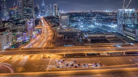 Construction activity in Dubai downtown with cranes and workers night timelapse Vídeo Stock 120401406