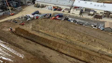 Construction Activity at a Large Site With Heavy Machinery and Materials Stock Photos