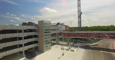 Construction Aerial Crane shot Pan up busy street downtown Stock Footage 64067357