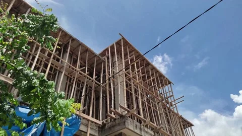 Construction against a cloudy blue sky Stock Footage 219994015