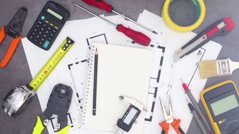 Construction and architecture tools moving on work table. Stop motion Stock Footage 136914204