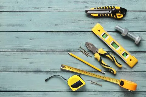 Construction and home improvement tools including a utility knife level plier Stock Photos