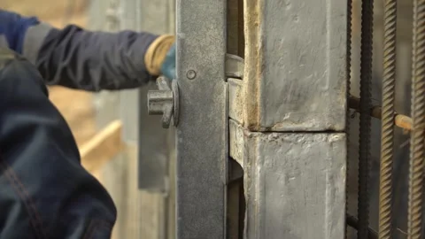 Construction and installation work, tighten the nut with a hammer Stock Footage 276964935