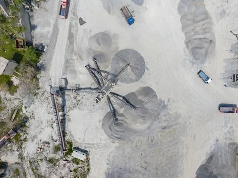 Construction and mining equipment working at a sand and gravel site with tr.. Stock Photos