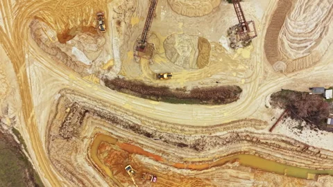 Construction and mining site with machinery and earth moving activities during Stock Footage 331901284