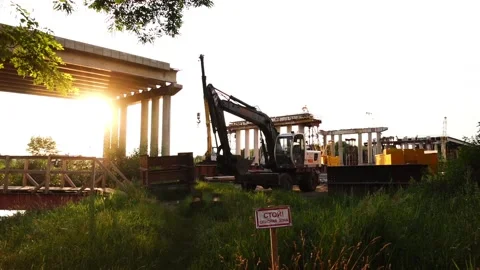 Construction and reconstruction of a bridge over a small river. summertime Gr Stock Footage 158184177