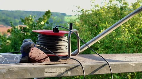 Construction and renovation.grinding machine, wires, construction glasses Stock Footage 317512264