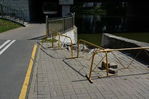 Construction and repair work of the sidewalk. The exit to the water was block Stock Photos