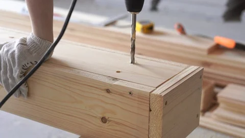 Construction and repair. working with wood - drilling holes close up Stock-Footage 107945848
