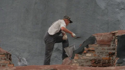 Construction and restoration work. Man works on brickwork 6 Stock Footage 118369563