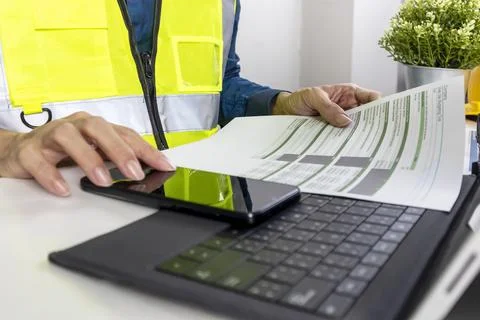 Construction and system engineers sit in their offices and check budgets an.. Stock Photos