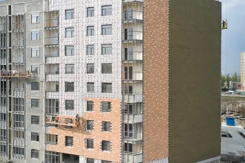 Construction of an apartment building with external wall Insulation Stock Photos