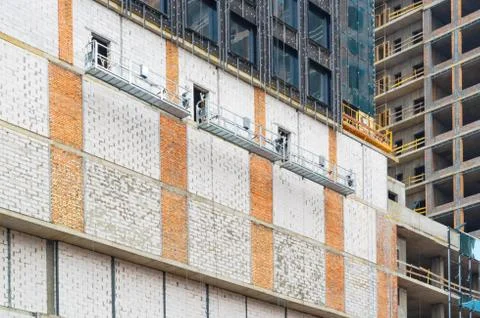 Construction of an apartment building made of bricks. Stock Photos