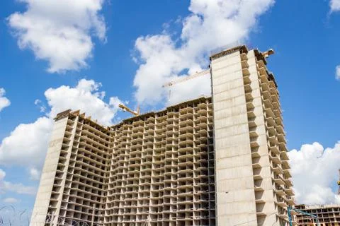Construction of an apartment building on the sky background Stock Photos