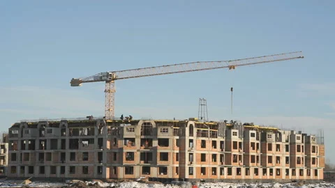 Construction of an apartment building in winter Stock Footage 129367346