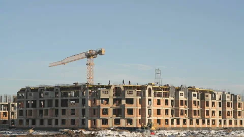 Construction of an apartment building in winter Stock Footage 129370095