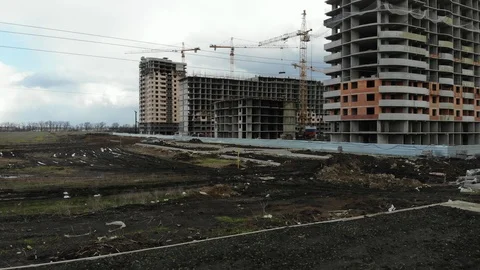 Construction of apartment buildings. Construction site from a height. Stock Footage 125345016