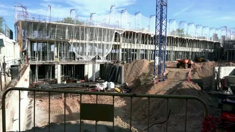 Construction of apartment buildings. Foundations and cranes for construction. Stock Footage 321899146
