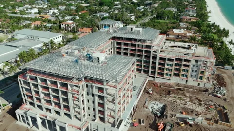 Construction of apartments or a hotel complex on the coast. Aerial wide shot Stock Footage 250272148