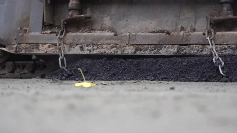 Construction of asphalt roads using an asphalt paver Stock Footage 321824866