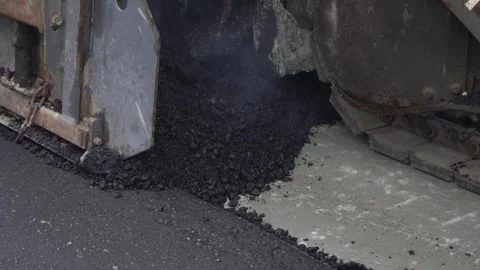 Construction of asphalt roads using an asphalt paver Stock Footage 321825570