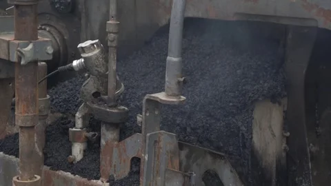 Construction of asphalt roads using an asphalt paver Stock Footage 321825609