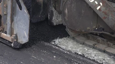 Construction of asphalt roads using an asphalt paver Stock Footage 321825925