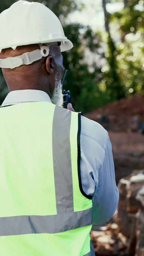Construction, back or black man on site with radio, task brief or inspection Stock Footage 340451098