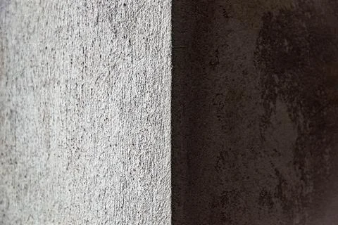 Construction background: corner of a rough wall of lime plaster Stock Photos