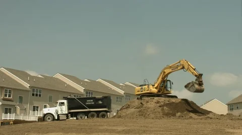 Construction Backhoe Digger Filling Dumptrucks with Dirt Fast Timelapse 4k Stock Footage 40947280