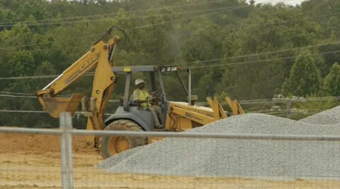Construction backhoe digging gravel Vídeo Stock 11140204
