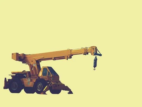 Construction backhoe with a pale yellow background Stock Photos