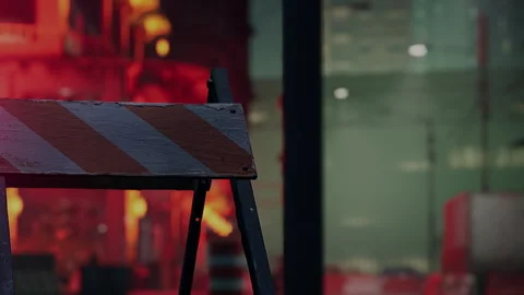 Construction Barriers Stand Firm Against a Backdrop of Bright Urban Activity Stock-Footage 344954676