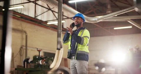 Construction, black man and phone call in factory for planning, remodeling ideas Stock Footage 340003504